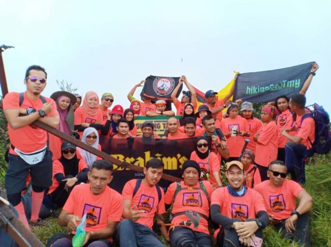 Participants at the peak of Gunung Tapis