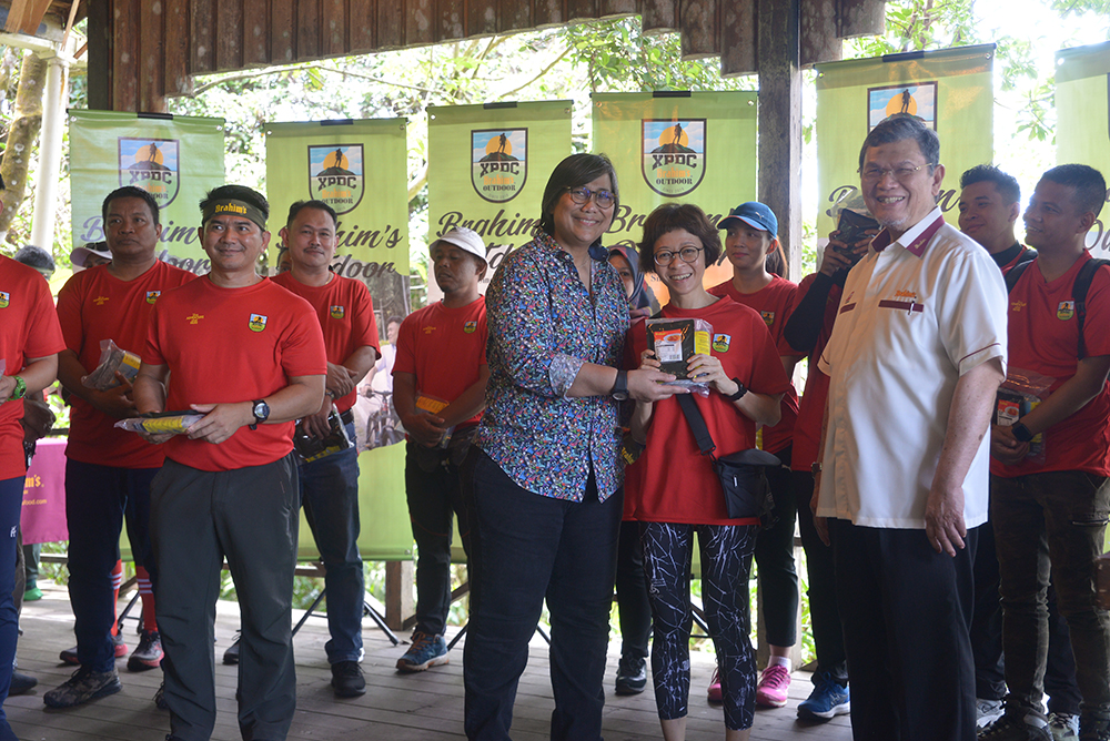 Participants receiving Brahim\'s Outdoor food pack before embarking on the trekking expedition.