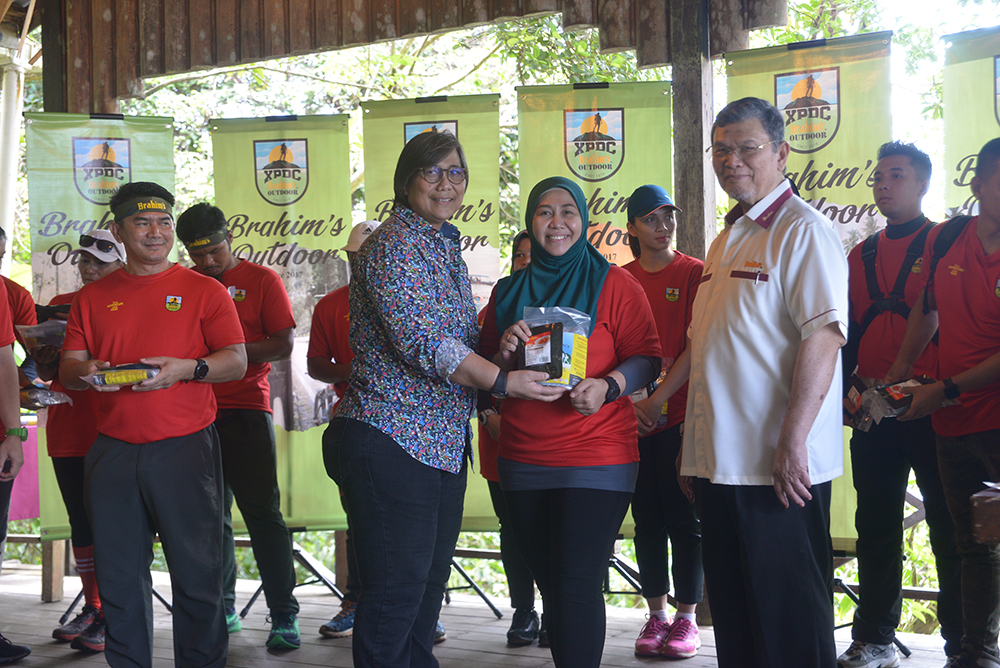 Participants receiving Brahim\'s Outdoor food pack before embarking on the trekking expedition.